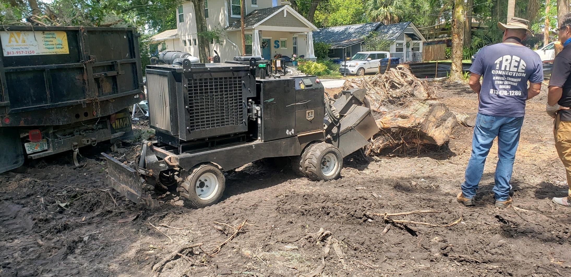 Allied Wrecking equipment and crew clearing a Tampa job site